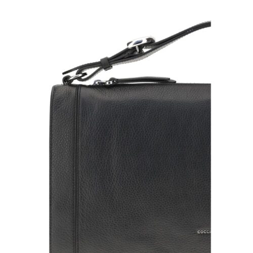 8843404.jpeg Coccinelle mustast vasikanahast Bos Taurus käekott